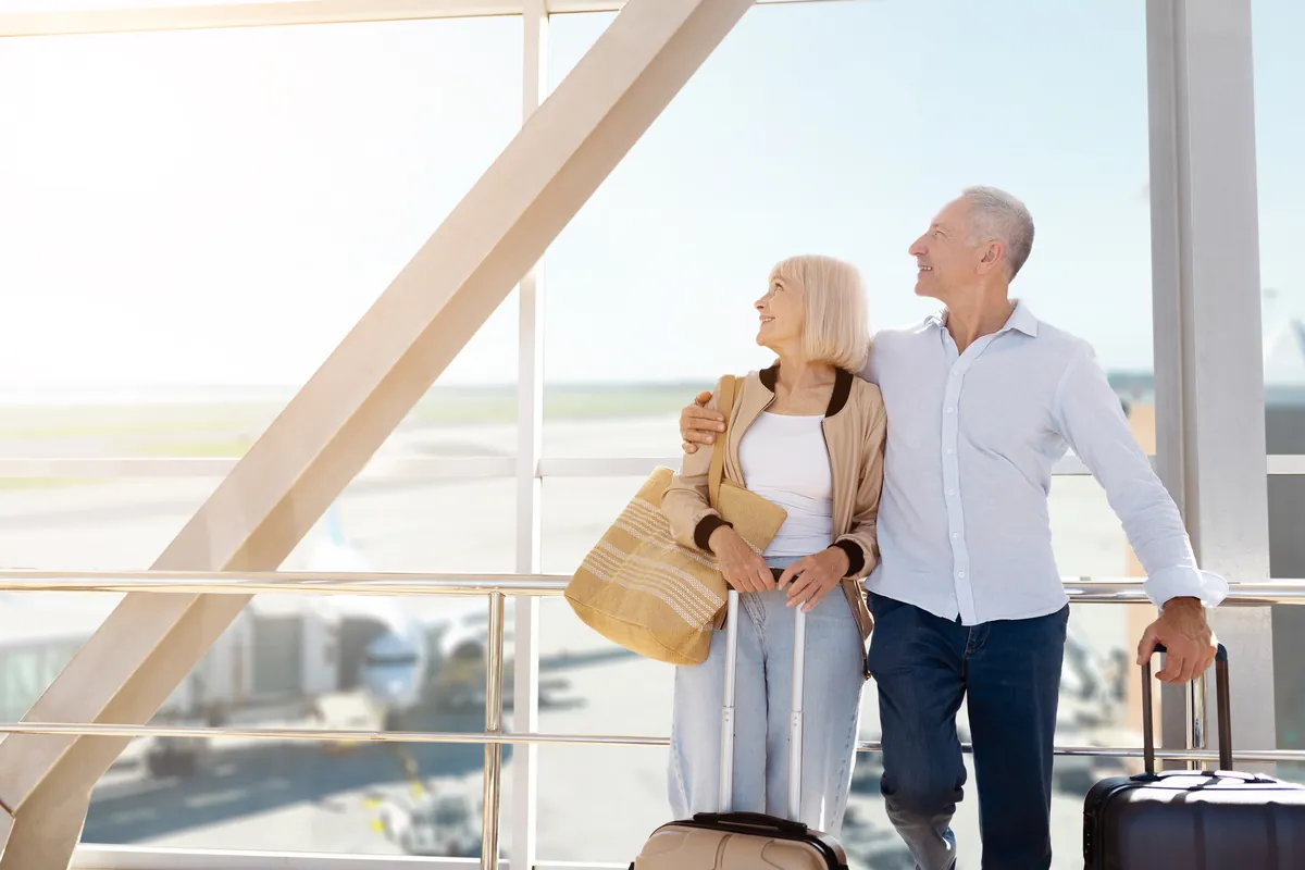 A couple looking out an airport window